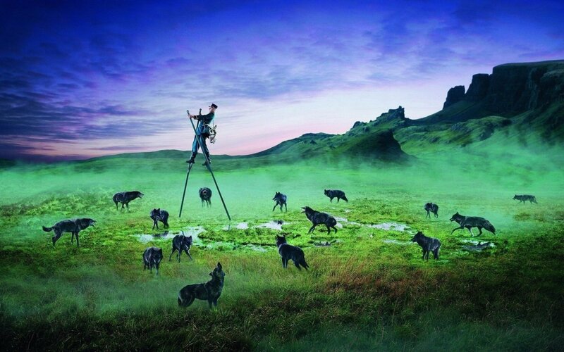 Man on Stilts with Wolves