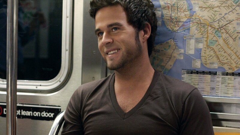 man on subway smiling