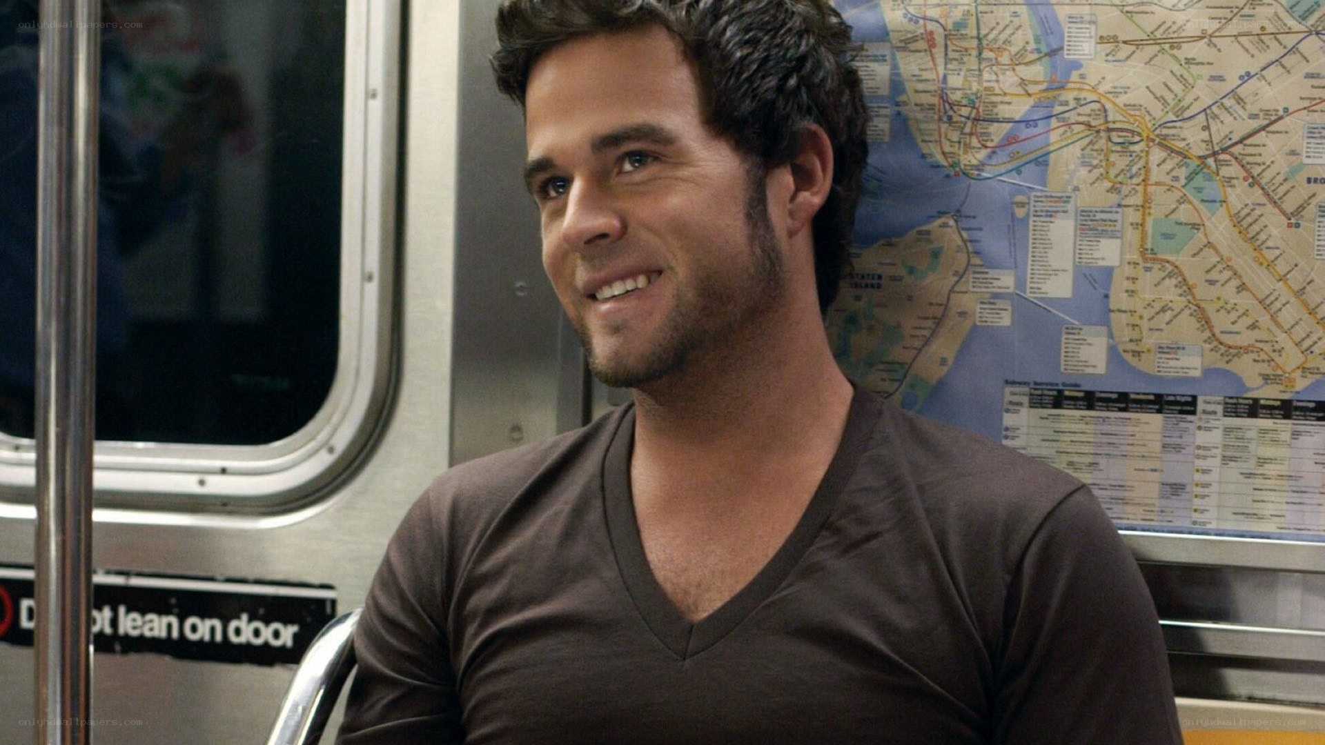 man on subway smiling
