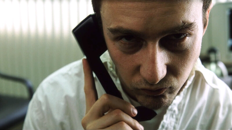 Man on Telephone — White, Intense