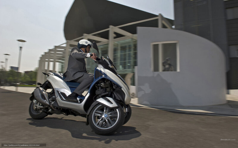 Man on Three-wheeled Scooter — Silver