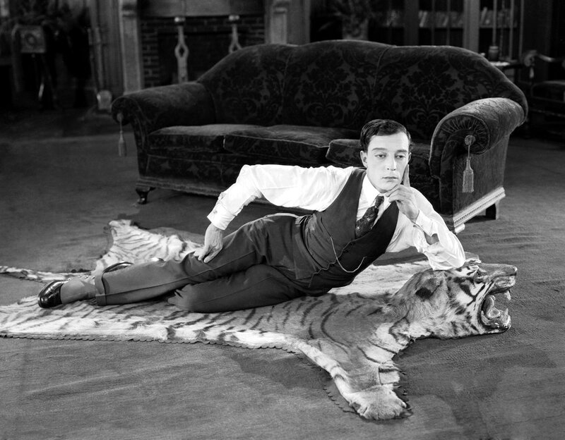 Man on tiger rug in living room