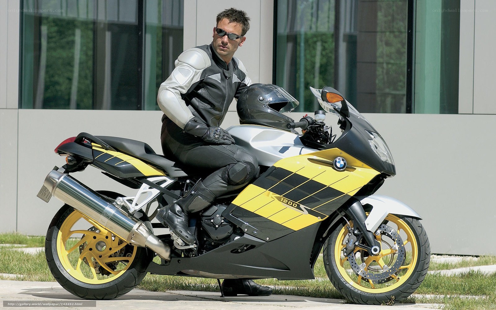 Man on yellow and black motorcycle