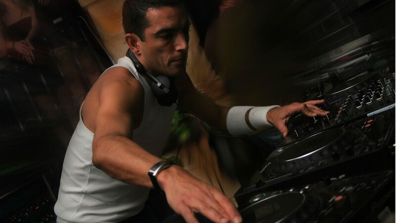Man Operating Dj Equipment