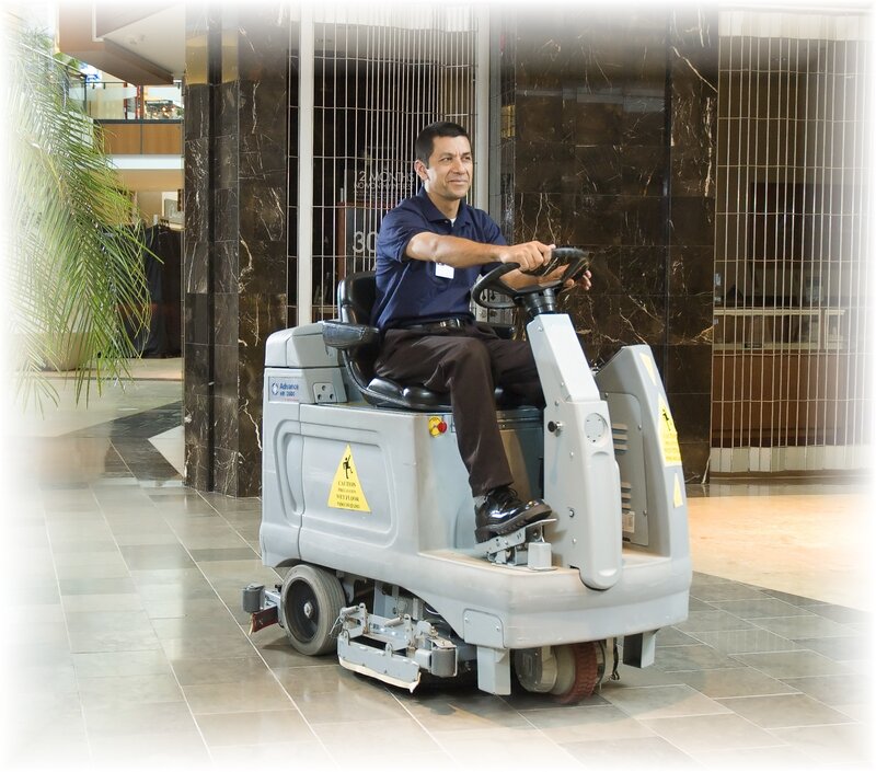 Man operating floor cleaning machine