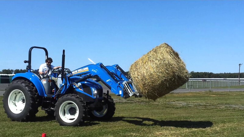Man Operating Tractor — Blue