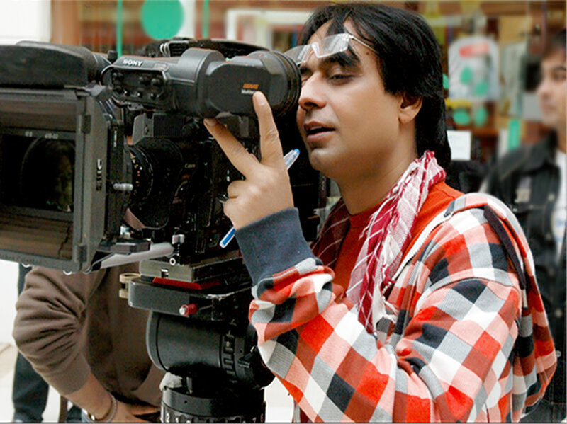 Man Operating Video Camera