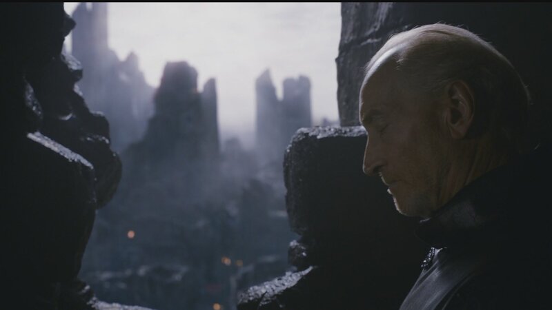 man overlooking a ruined city