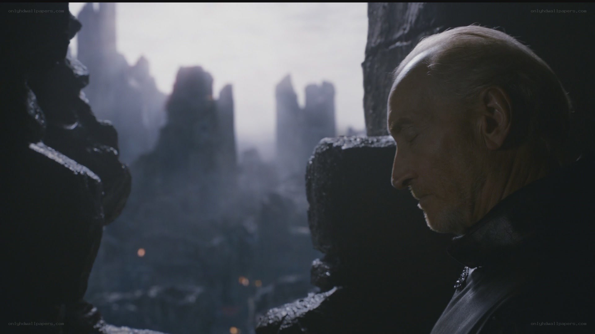 man overlooking a ruined city