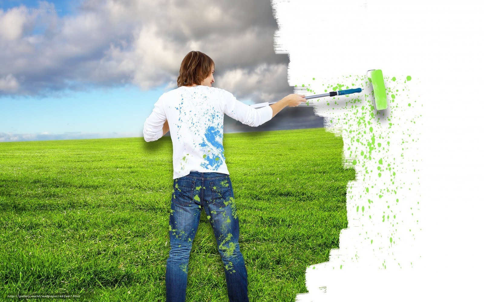 man painting a green field