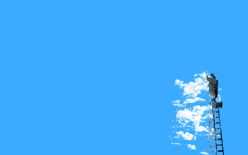 man painting clouds on blue sky