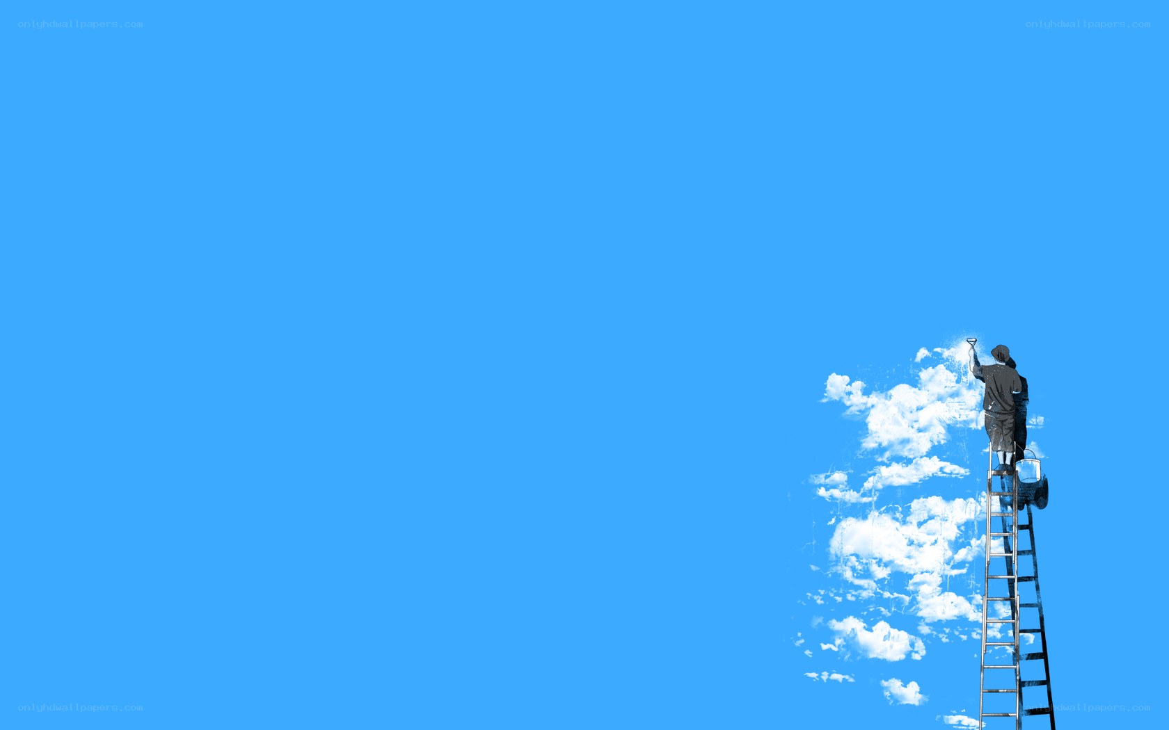 man painting clouds on blue sky