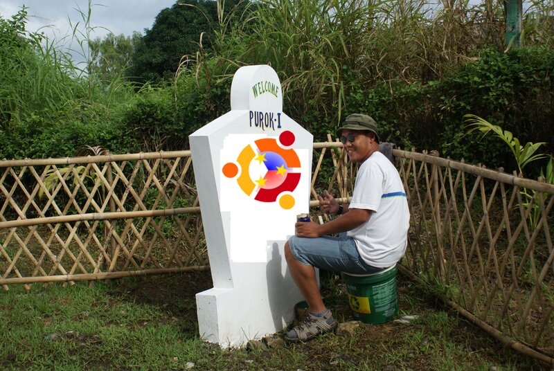 Man painting welcome sign