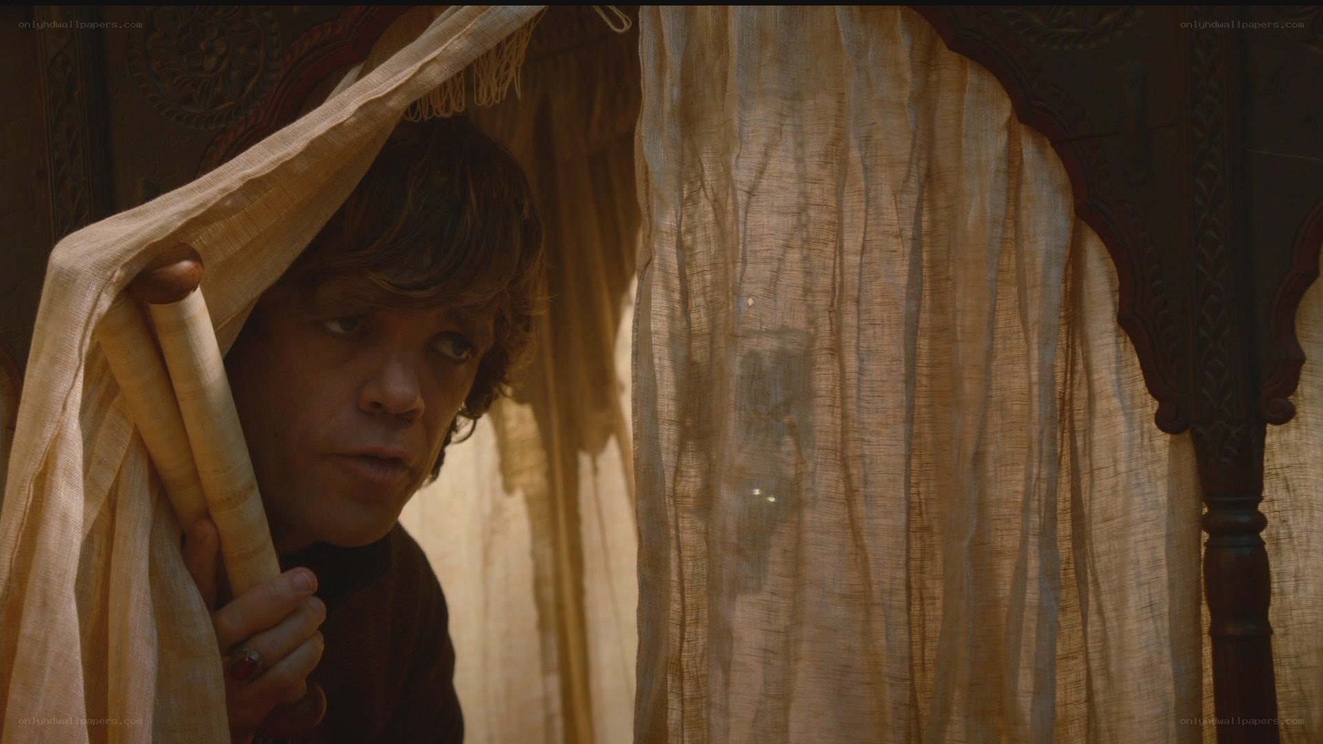 man peeking from behind curtain