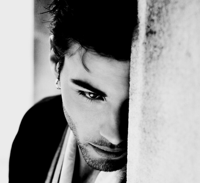 Man Peeking from Wall