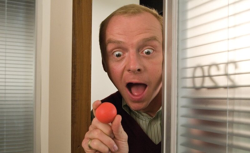 man peeking with red ball