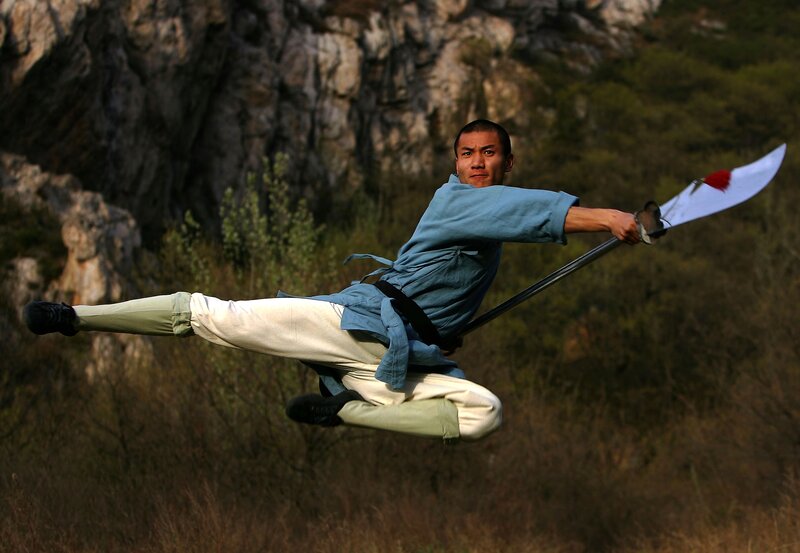 Man performing martial arts with sword