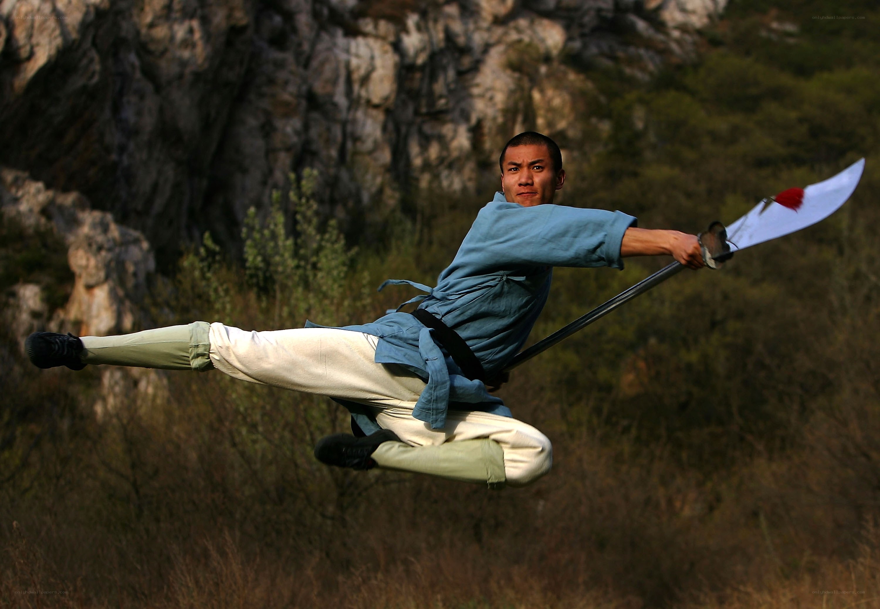 Man performing martial arts with sword