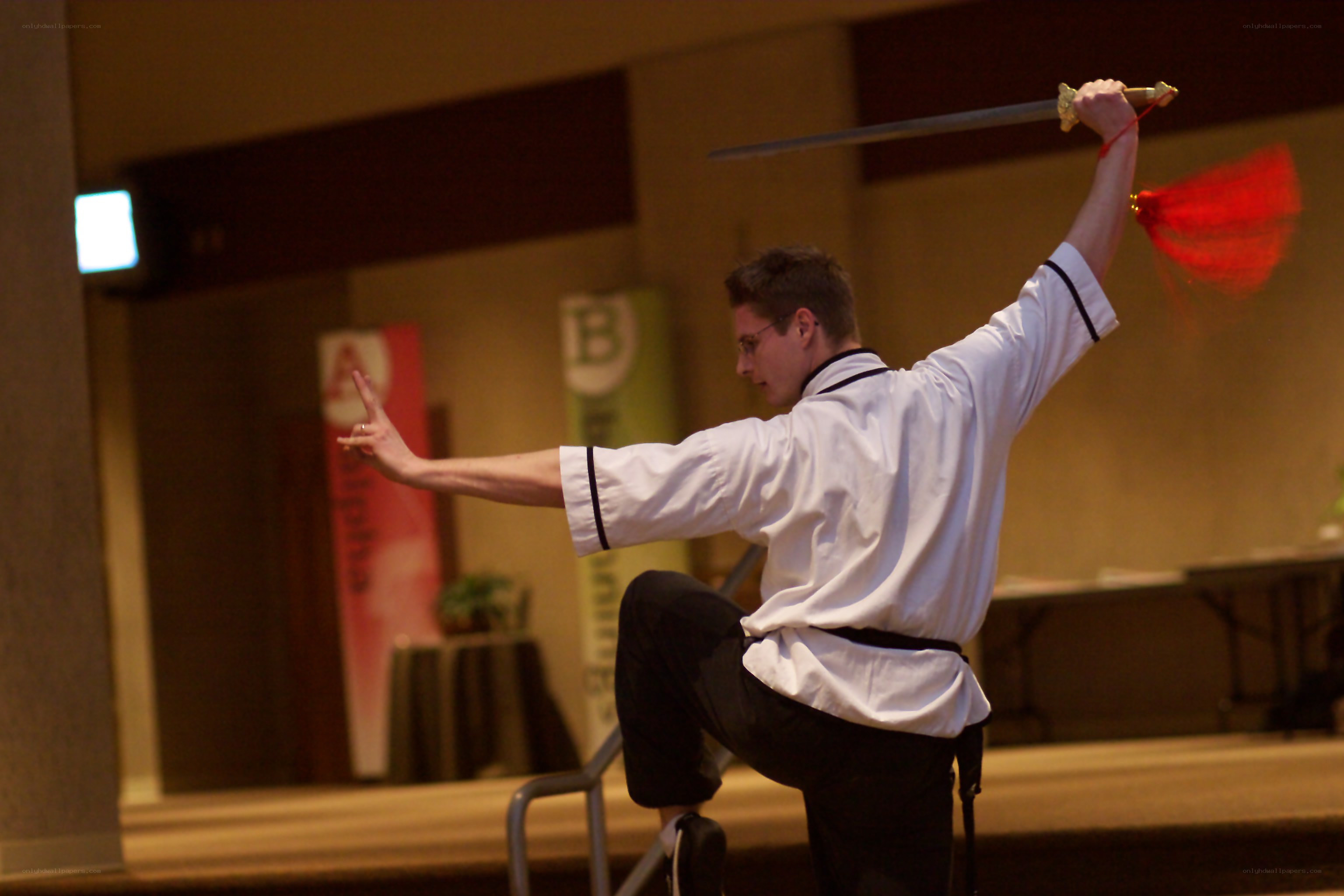 Man performing martial arts with sword
