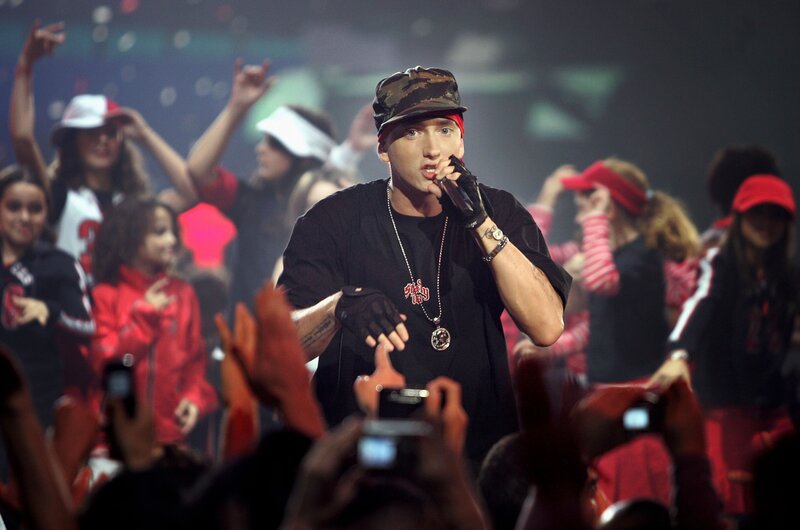 Man Performing on Stage — Black, Energetic, Night, Photograph, Crowd