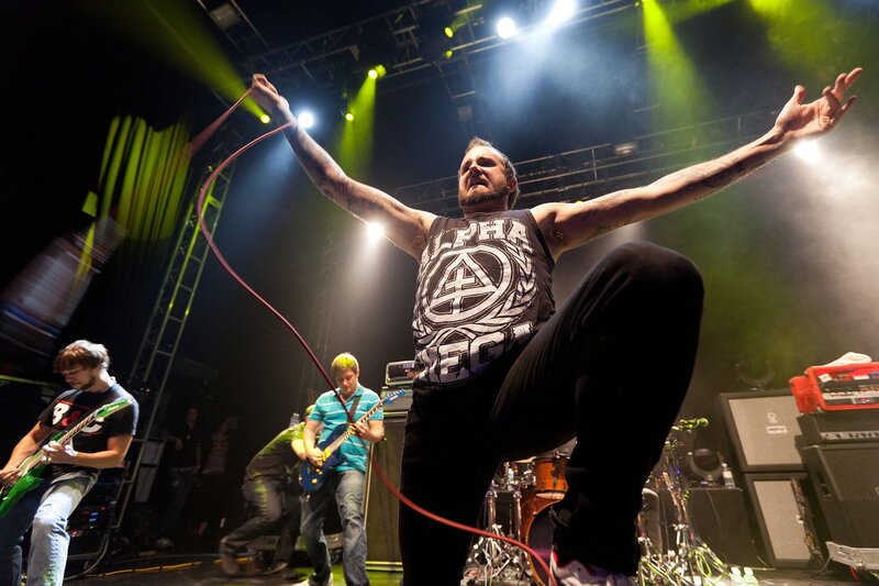 Man Performing on Stage — Black, Energetic
