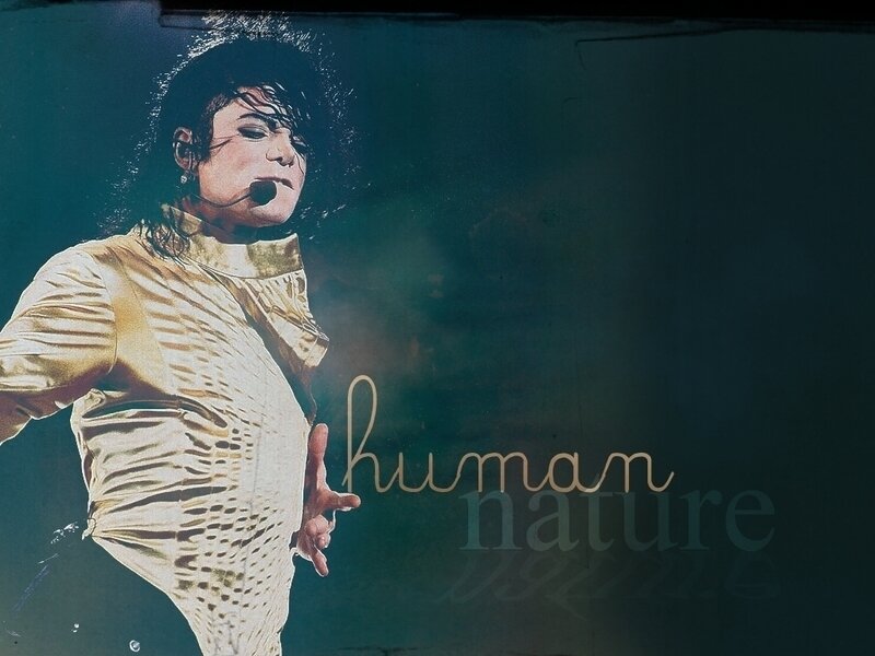 Man Performing on Stage — Gold