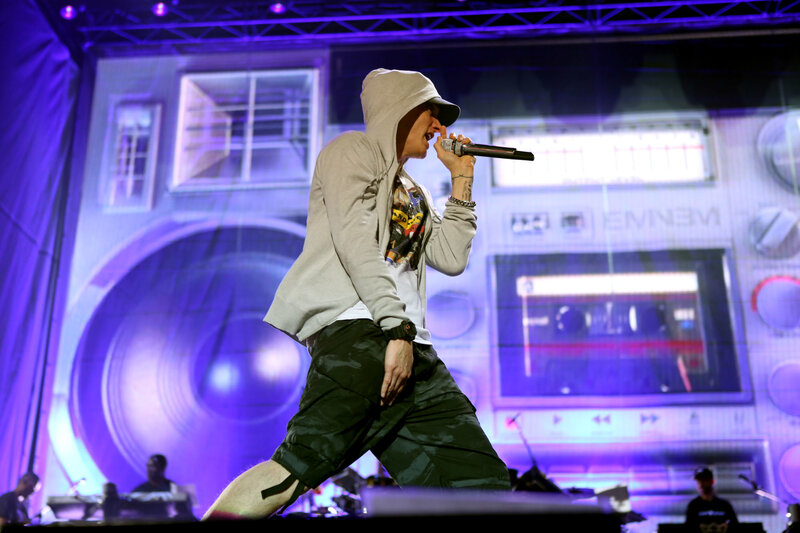 Man Performing on Stage — Purple