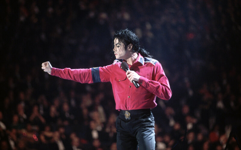 Man Performing on Stage — Red, Energetic