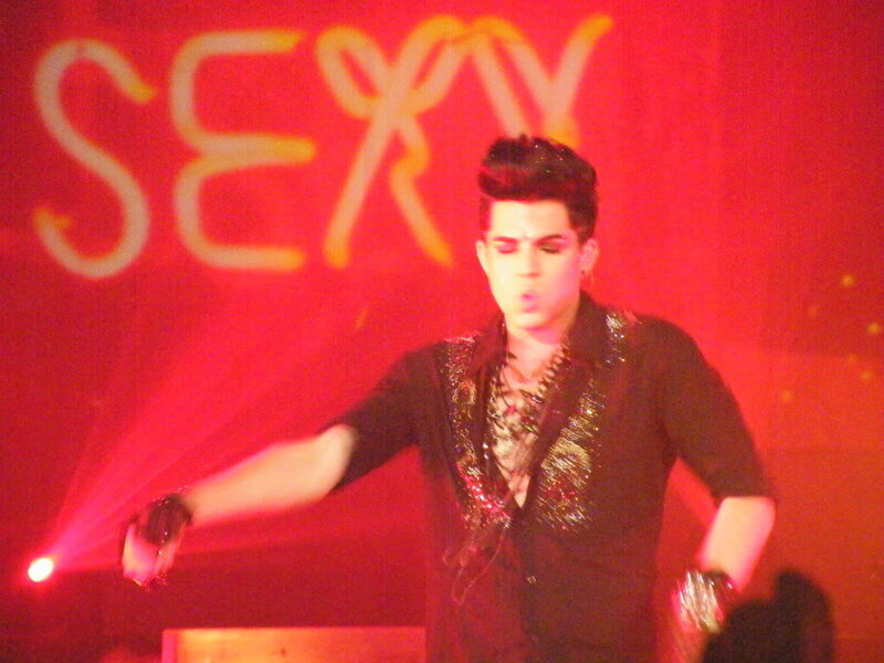 Man Performing on Stage — Red