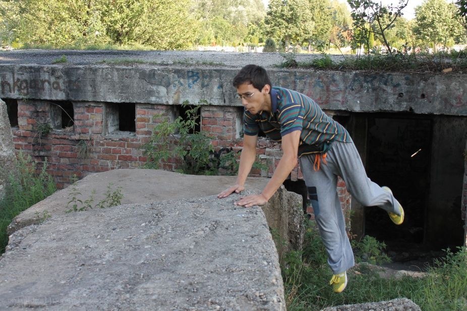 Man performing parkour on concrete