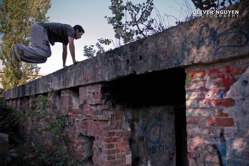 Man performing parkour on wall
