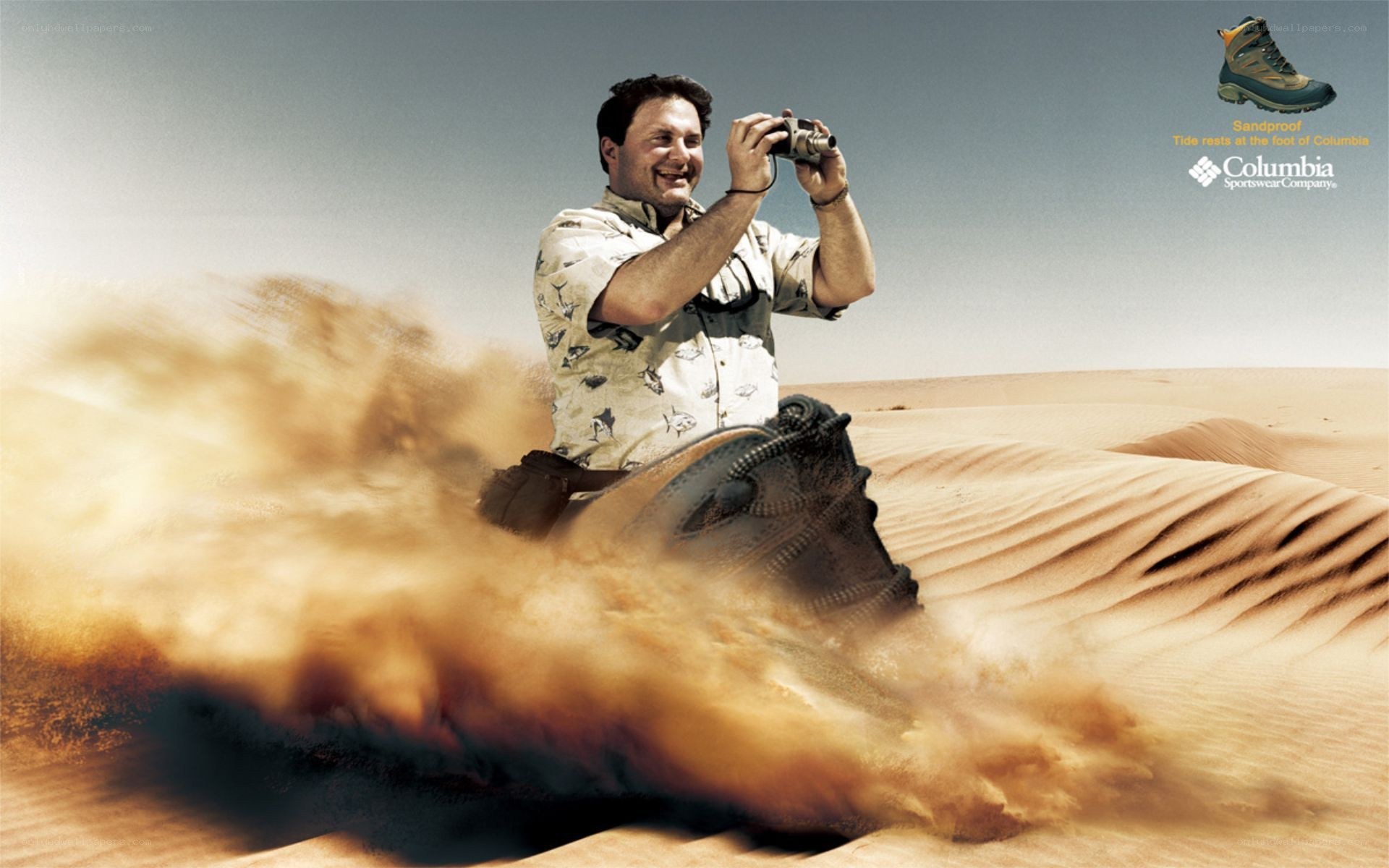 Man photographing in desert