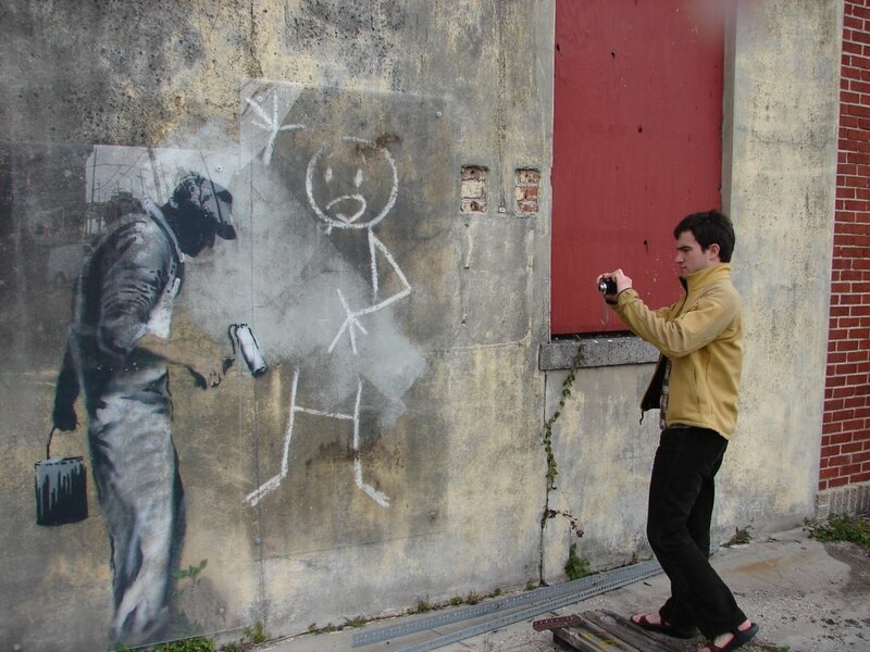 Man photographing street art
