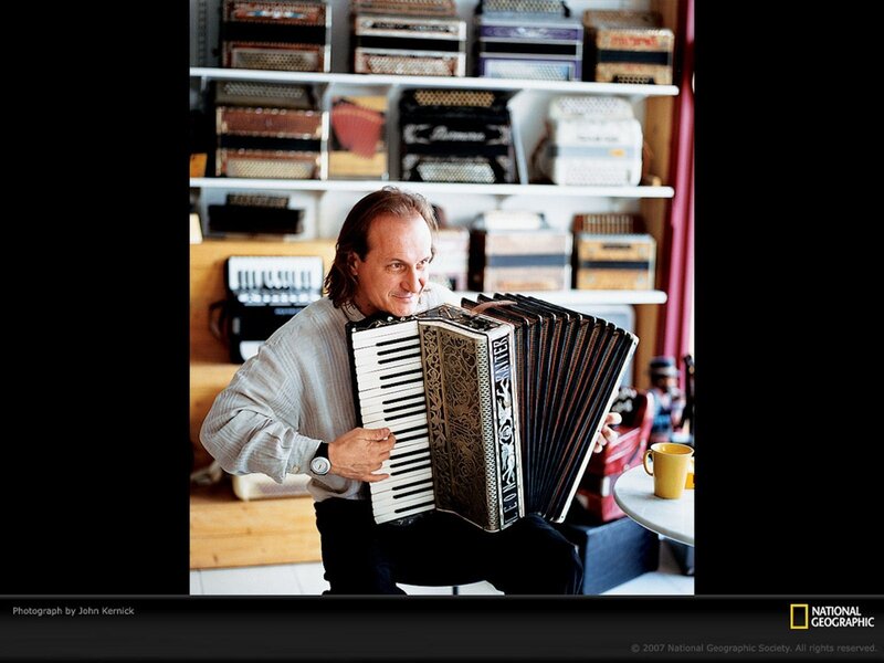 Man playing accordion in music room