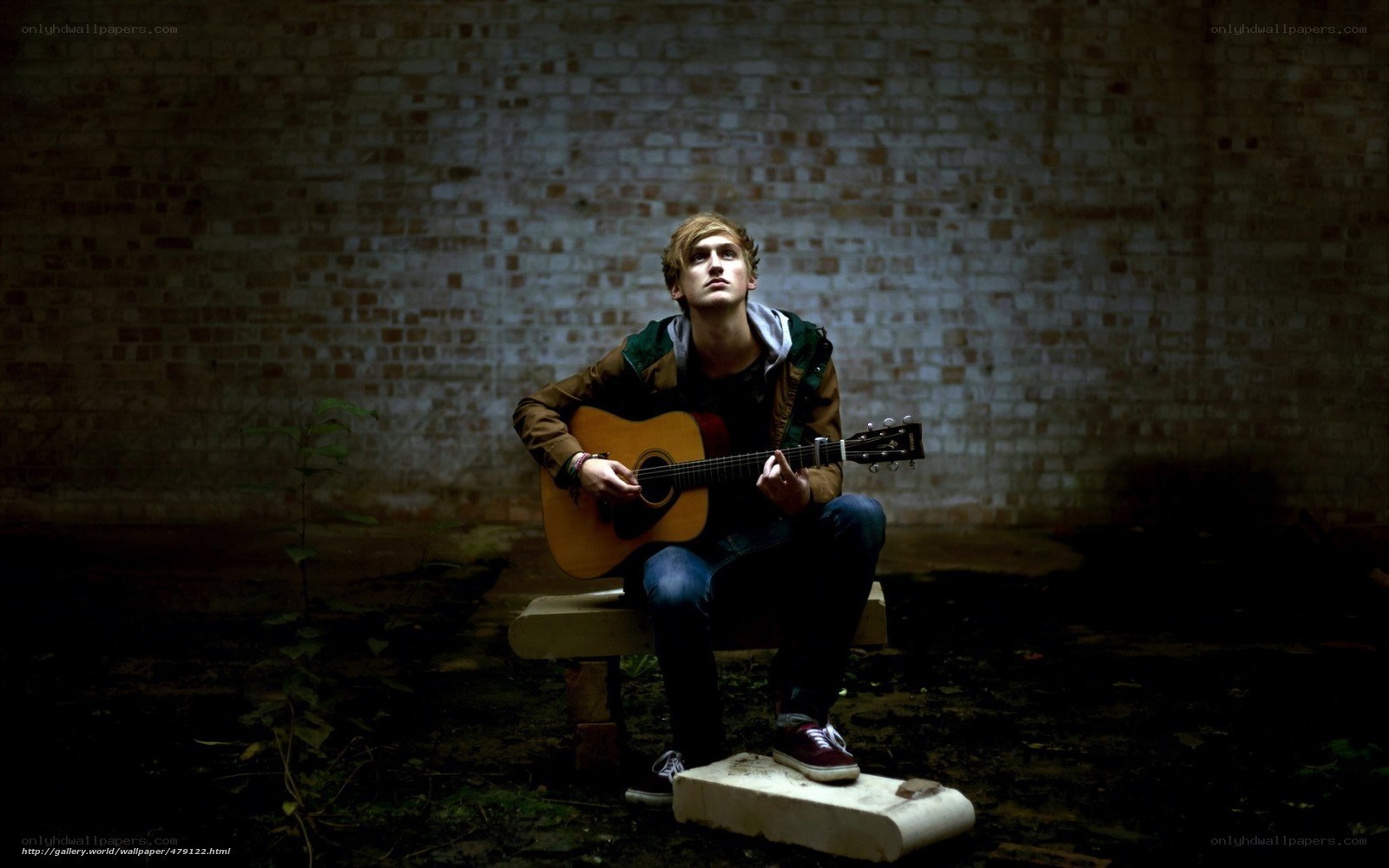 man playing acoustic guitar