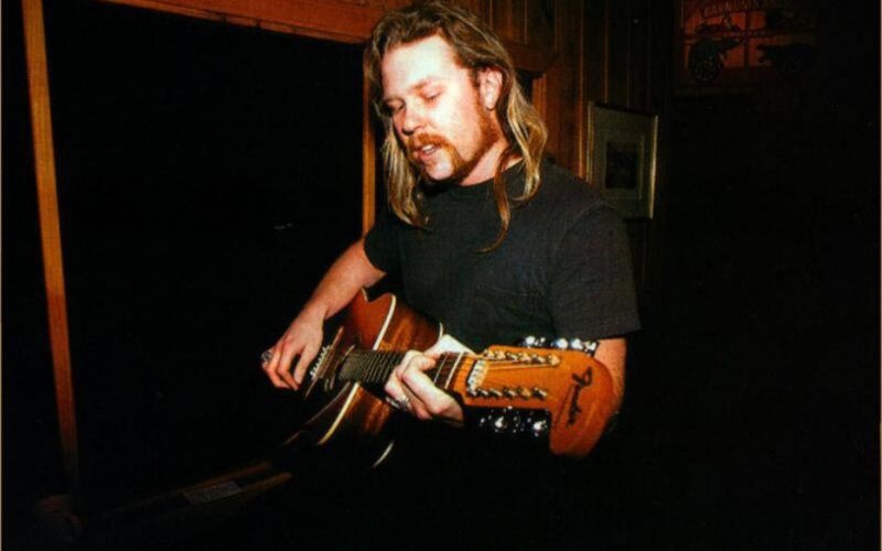 man playing acoustic guitar