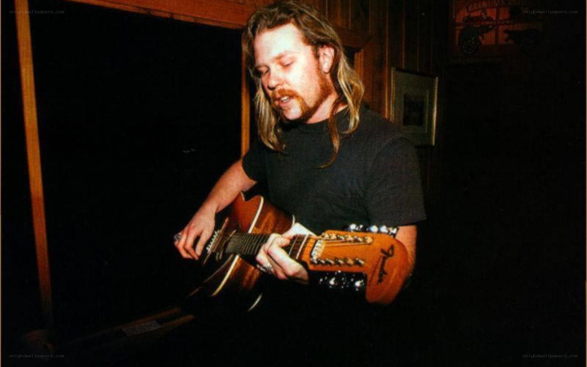 man playing acoustic guitar