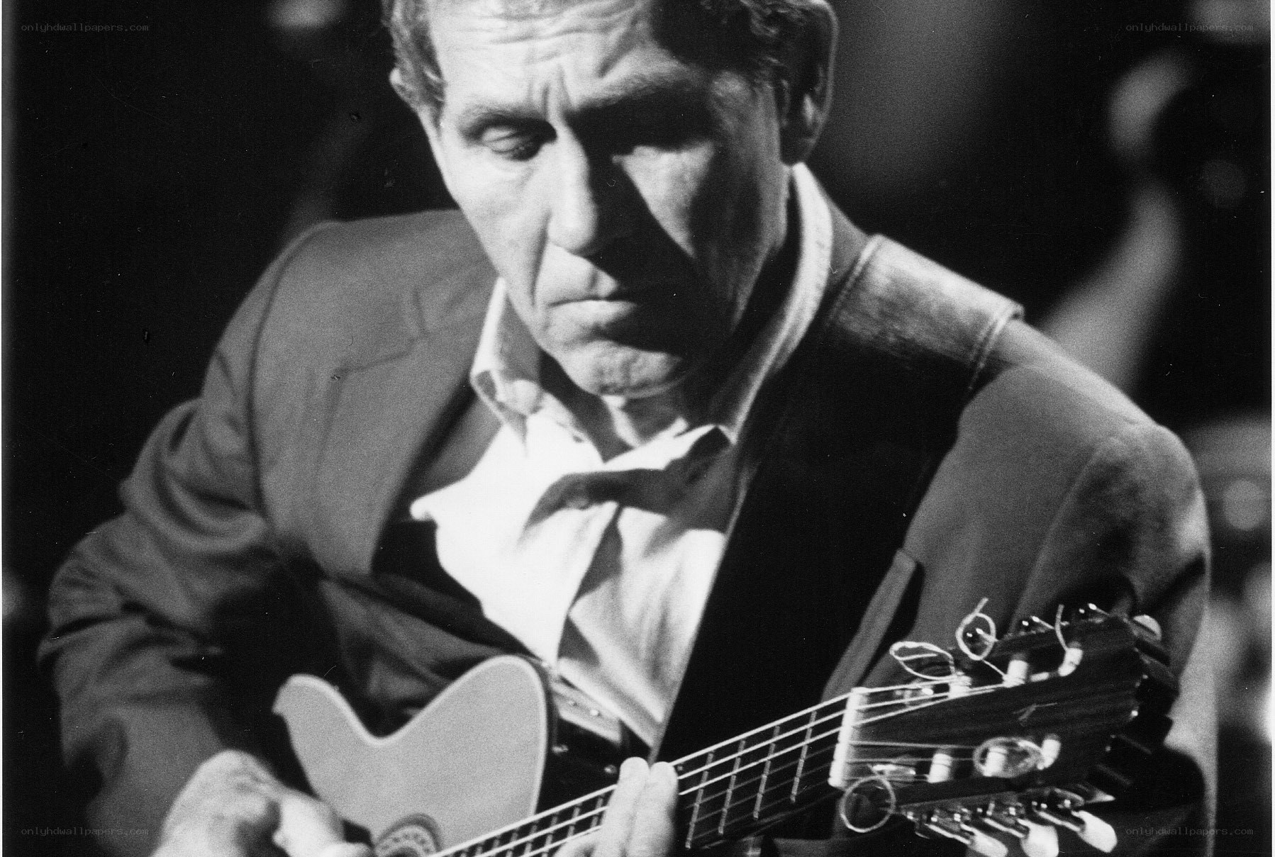 man playing acoustic guitar