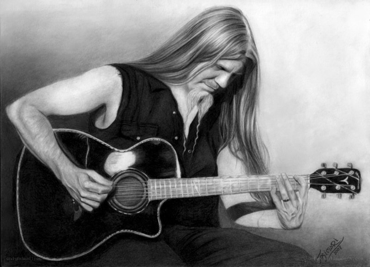 man playing acoustic guitar