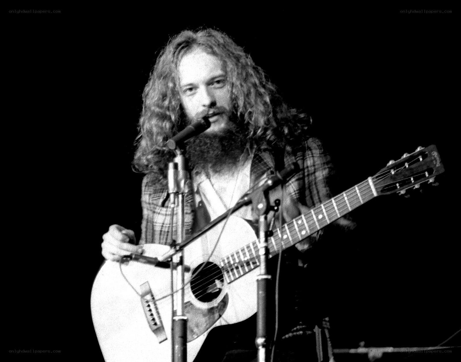 man playing acoustic guitar