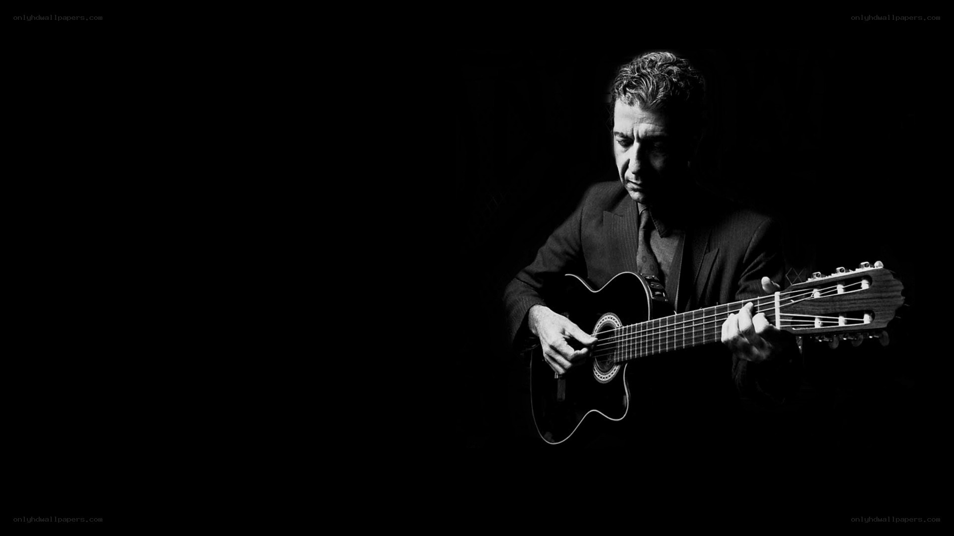 man playing acoustic guitar