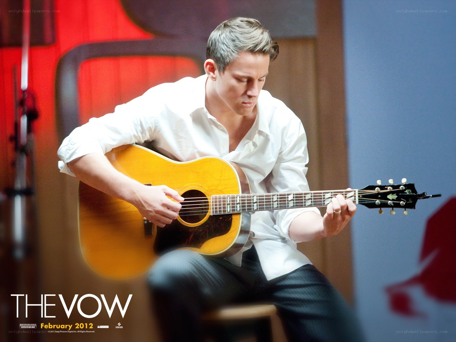 man playing acoustic guitar