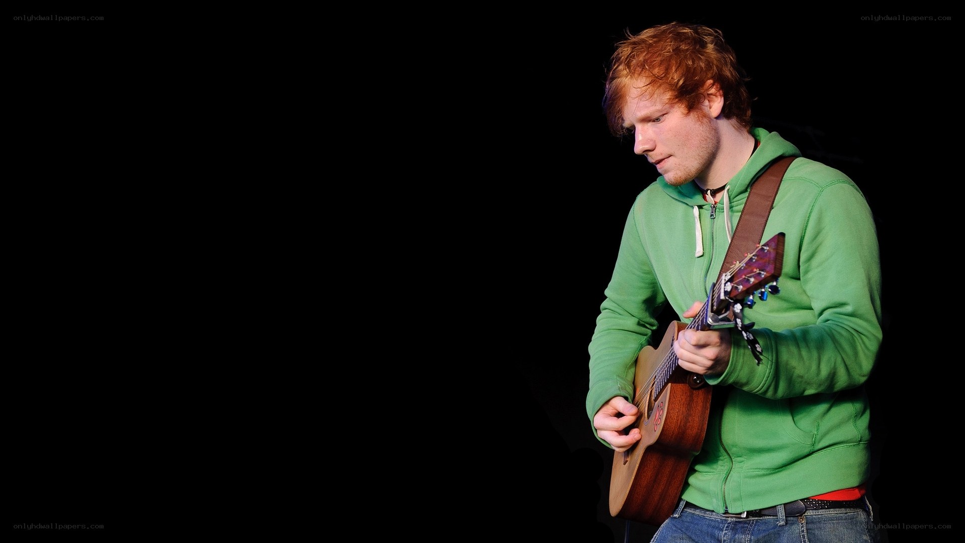 man playing acoustic guitar