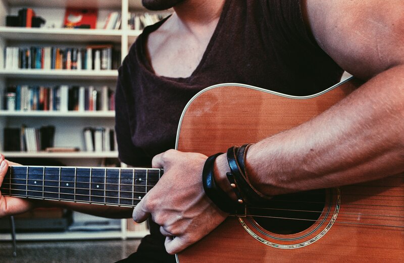 Man Playing Acoustic Guitar — Brown, Calm