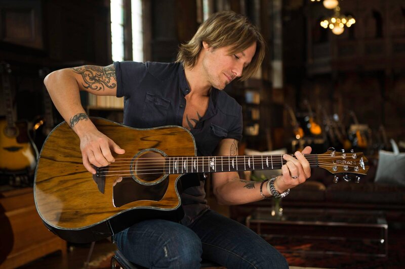 Man Playing Acoustic Guitar — Brown, Focused