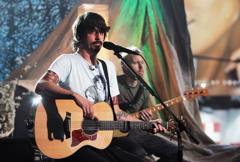 Man playing acoustic guitar on stage