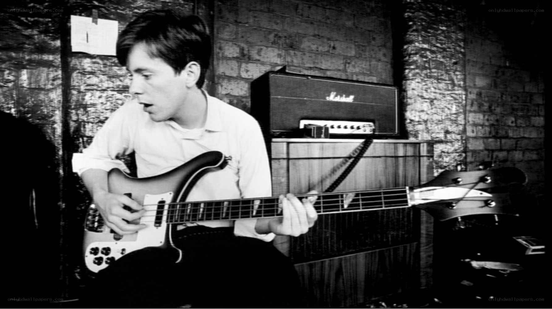 man playing bass guitar