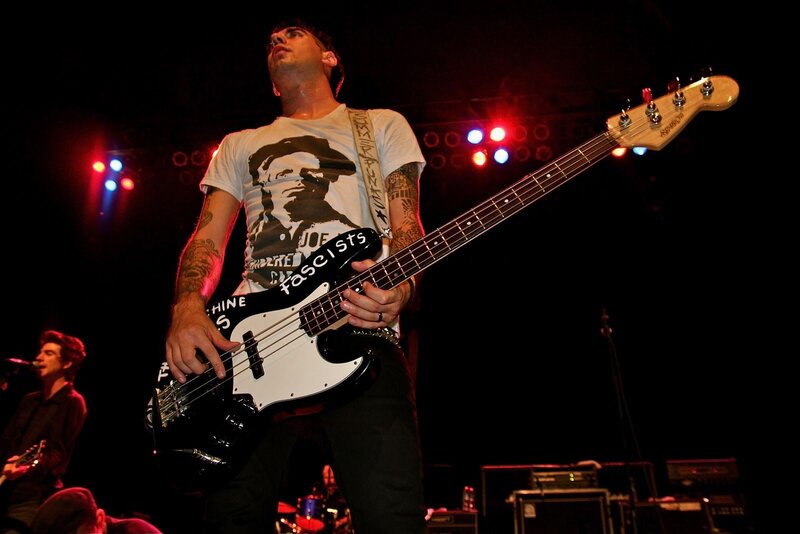 Man Playing Bass Guitar — Black, Energetic, Night