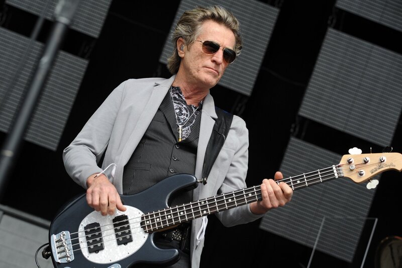 Man Playing Bass Guitar — Black, Focused