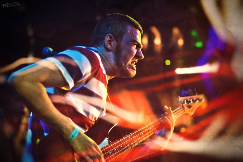 Man Playing Bass Guitar — Red, Energetic, Night, Photograph
